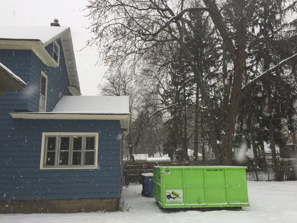 Dumpster Rental Tight Against House