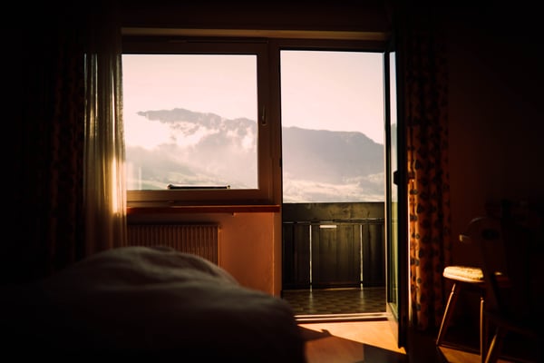 Light Coming Through Dark Bedroom